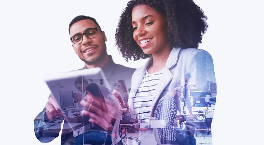 Photograph of man and woman studying mobile device with office scene in background