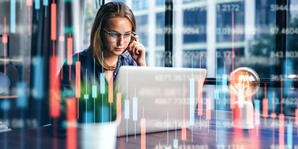 Photograph of woman staring at laptop