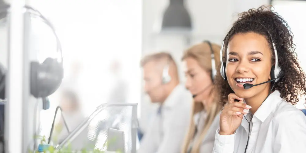 Cover image woman wearing headset in an office