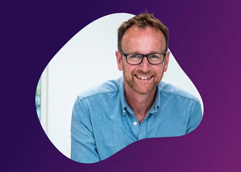 Photograph of Richard Lane with purple background