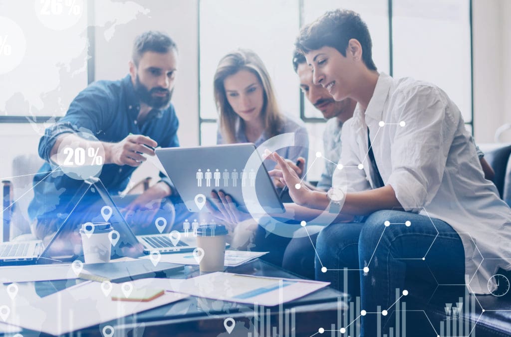 Photograph of sales team overlaid with digital diagrams